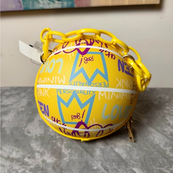 Trendy boutique Handbags - Brand New Yellow Graphic Round Bag with Chain